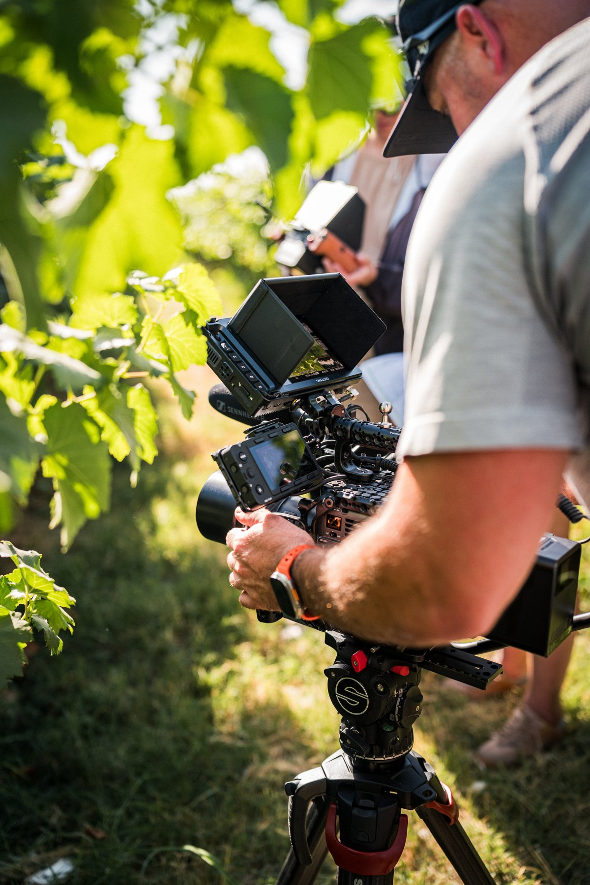 Operator preparing the BURANO on a tripod