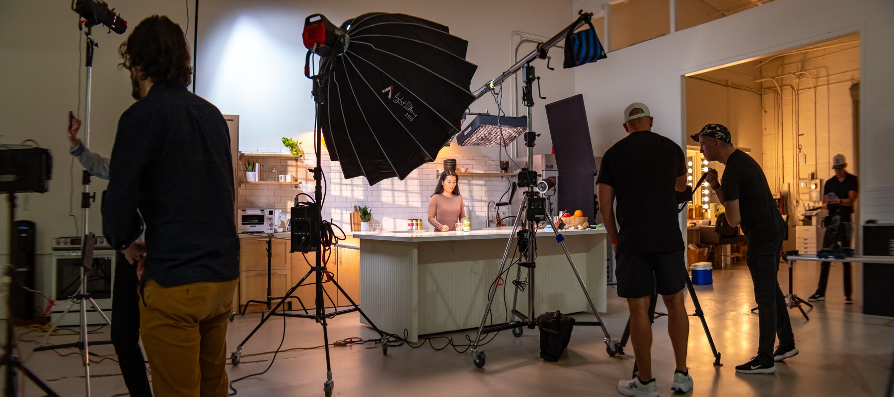The crew and lighting package around the kitchen set.
