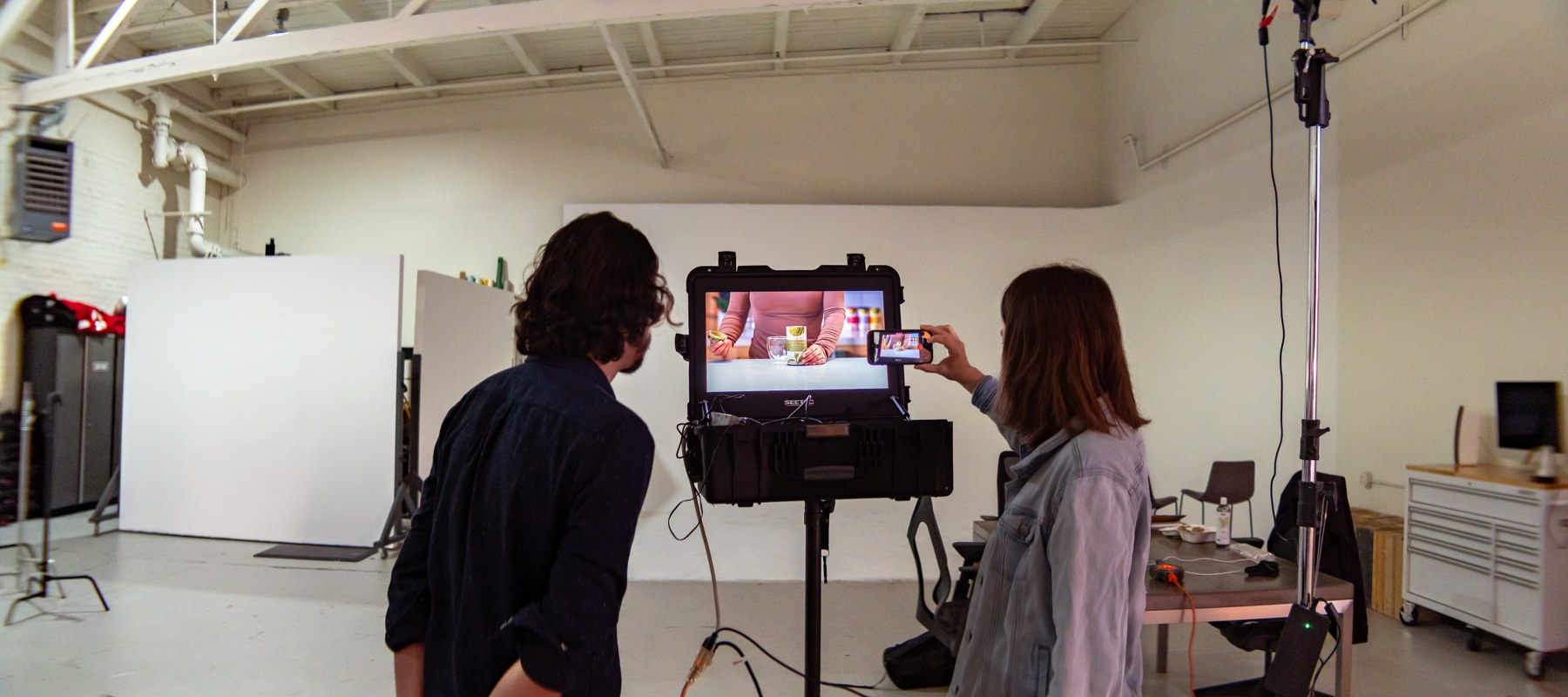 Client viewing the camera feed on a production monitor