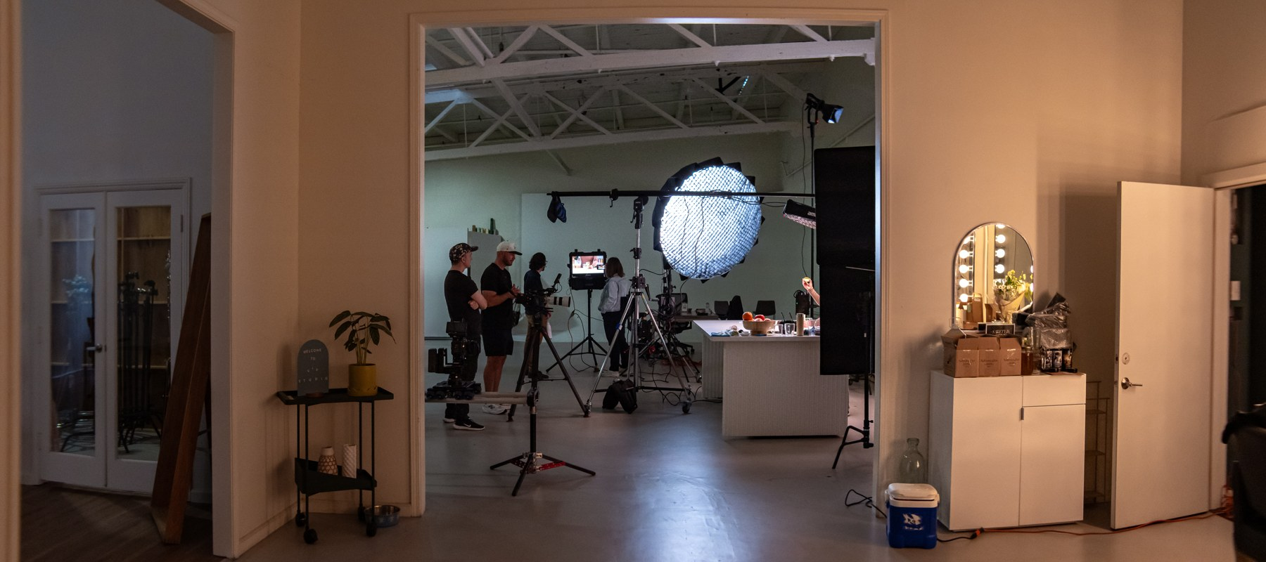 A wider view of the studio and kitchen setup.